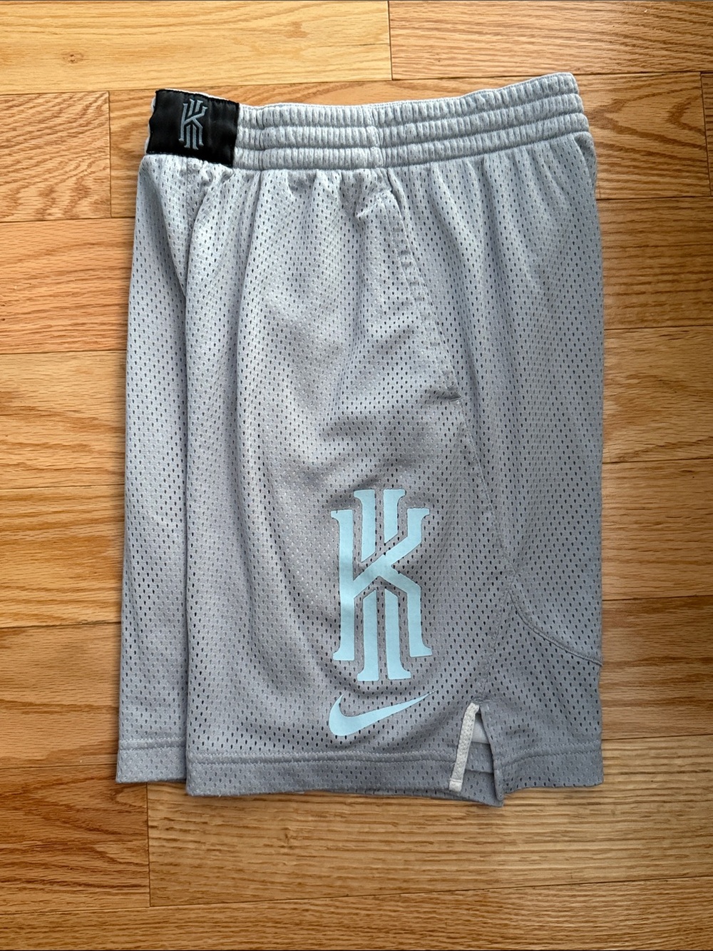 Nike Dry fit Kyrie Irving Graphic Mesh Basketball Shorts in a cool grey colorway